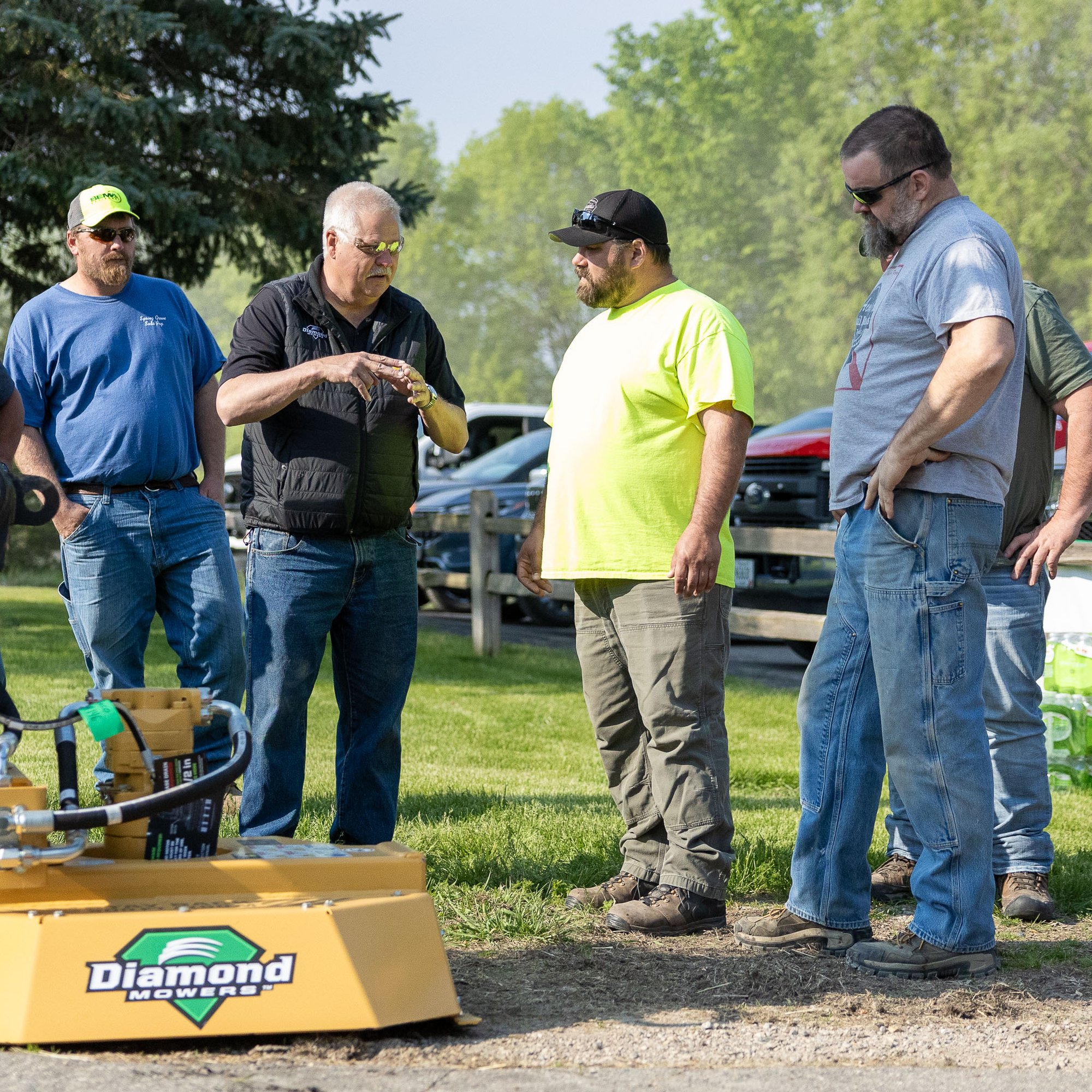 people around an attachment showing the operation